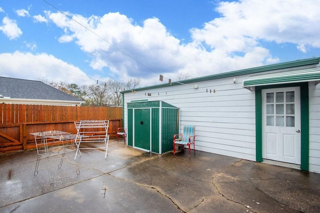 view of patio / terrace featuring a storage shed