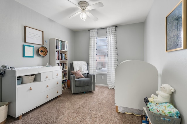 living area with ceiling fan and light carpet