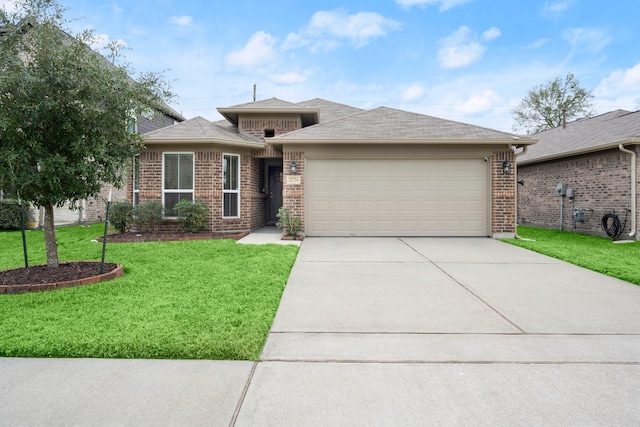 view of front of property featuring a front lawn and a garage