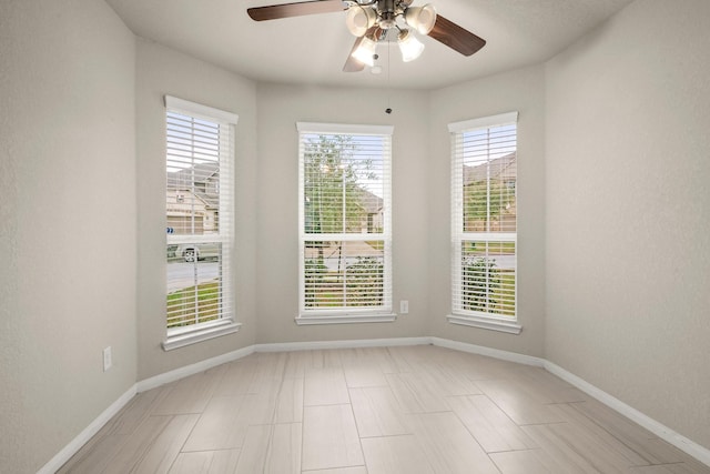 spare room featuring ceiling fan