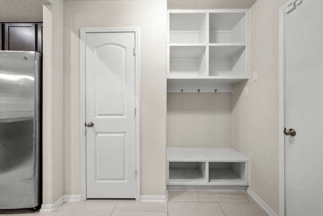 mudroom with light tile patterned flooring