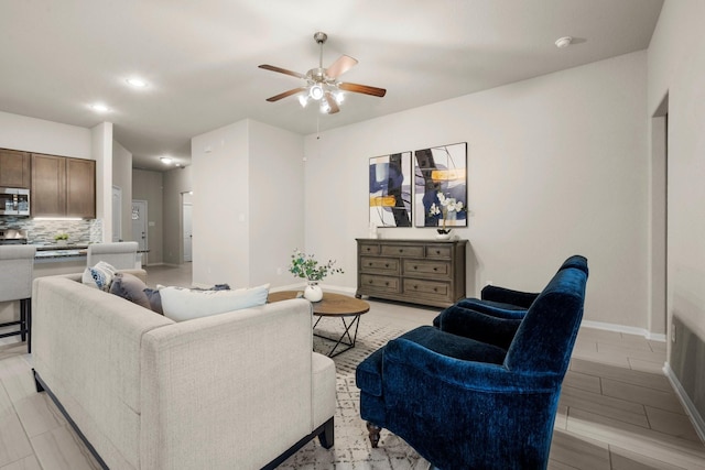 living room featuring ceiling fan