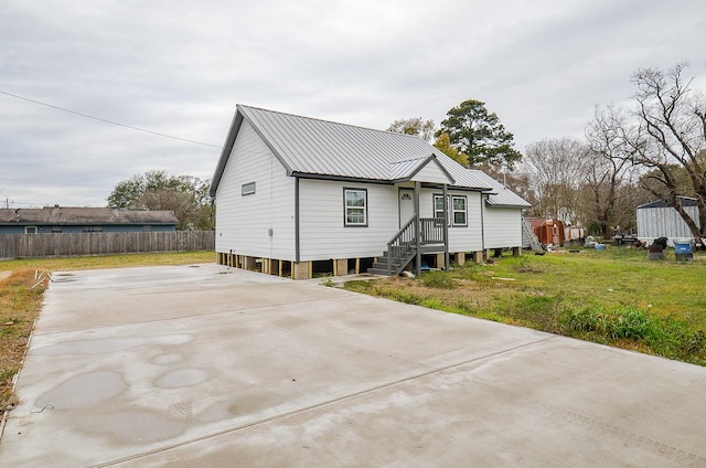 rear view of house with a lawn