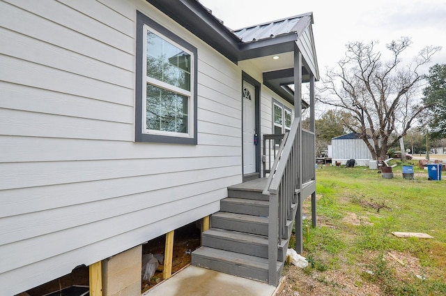 view of side of home featuring a yard