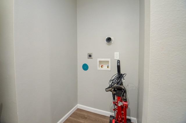 2706 Sledge St, Waller, TX 77484 - laundry room with hookup for an electric dryer, washer hookup, wood finished floors, and baseboards