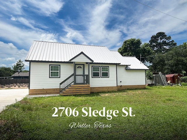 2706 Sledge St, Waller, TX 77484 - view of front facade featuring metal roof
