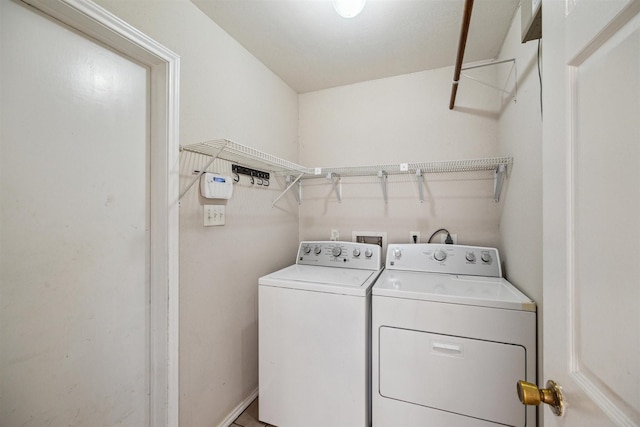 washroom featuring independent washer and dryer