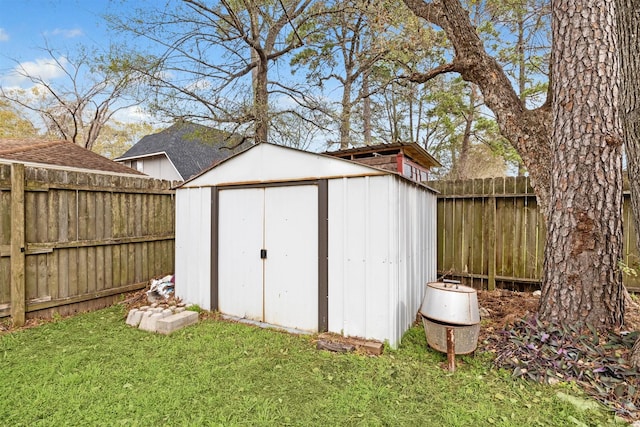 view of outbuilding with a lawn