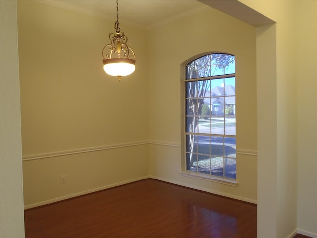 unfurnished room with dark hardwood / wood-style flooring and crown molding