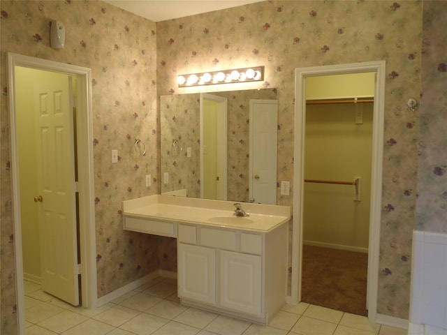 bathroom with tile patterned flooring and vanity