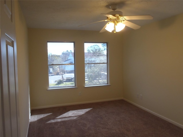 carpeted empty room with ceiling fan