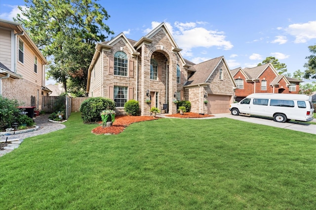 view of front facade with a garage and a front yard