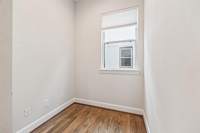 empty room featuring wood-type flooring