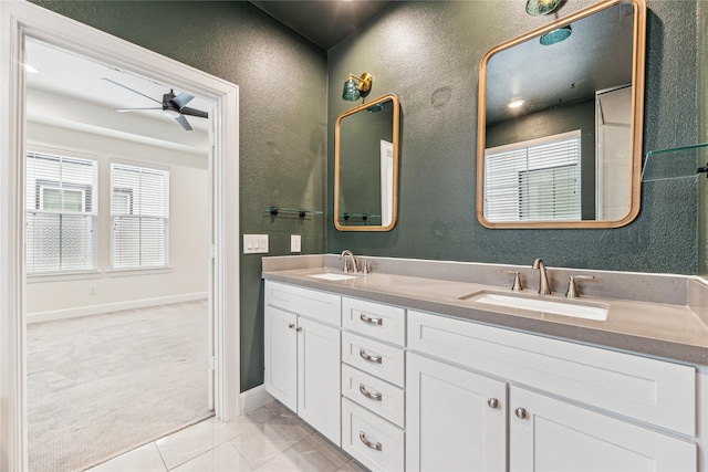 bathroom featuring ceiling fan, tile patterned flooring, and vanity