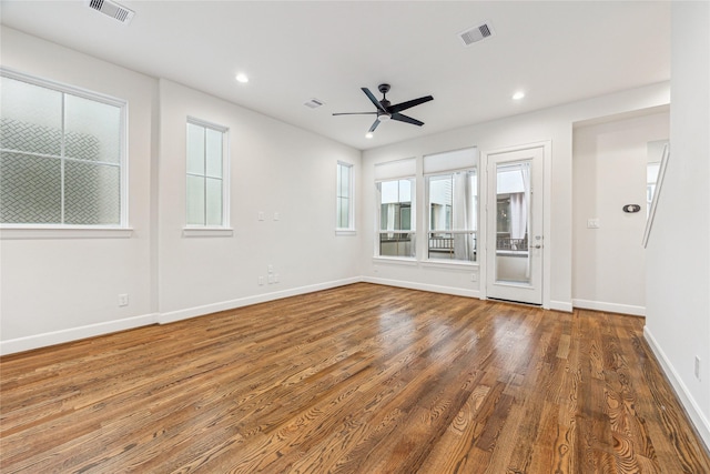 unfurnished room featuring ceiling fan and hardwood / wood-style floors