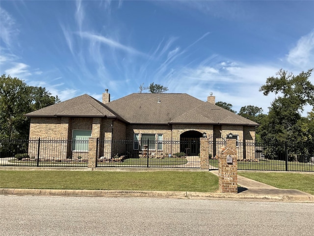 view of front of property with a front lawn