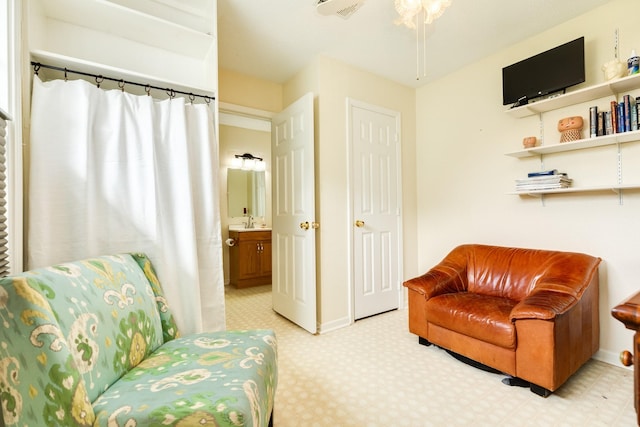 living area featuring visible vents and baseboards