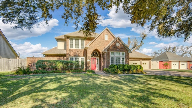 front facade featuring a front lawn and a garage