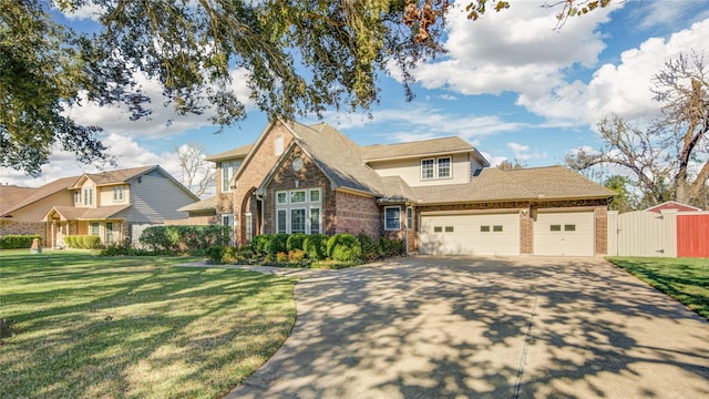 view of front of property featuring a garage and a front lawn