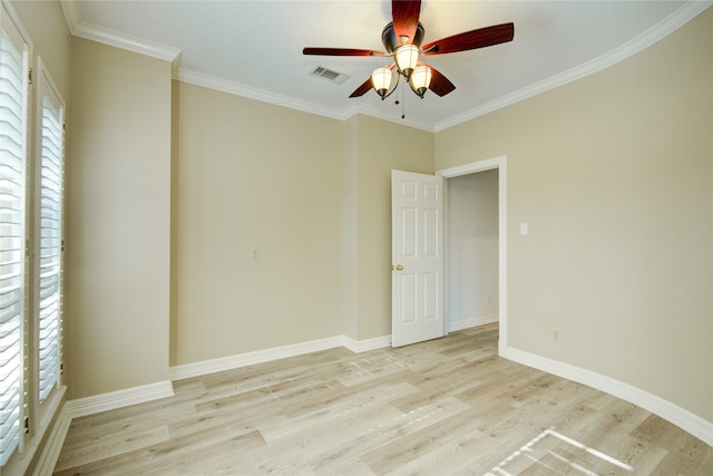 spare room with ceiling fan, light hardwood / wood-style floors, and crown molding