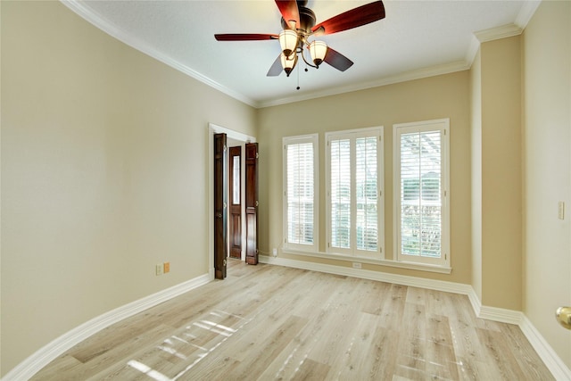 spare room featuring ceiling fan, crown molding, and light hardwood / wood-style flooring