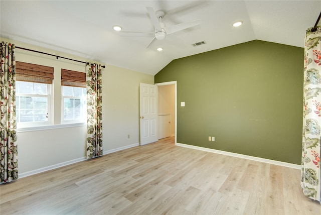 unfurnished bedroom featuring vaulted ceiling, ceiling fan, and light hardwood / wood-style floors