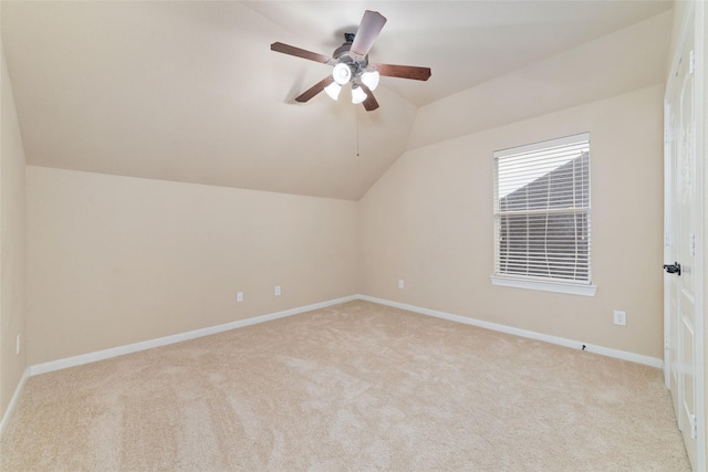 additional living space with ceiling fan, light carpet, and lofted ceiling