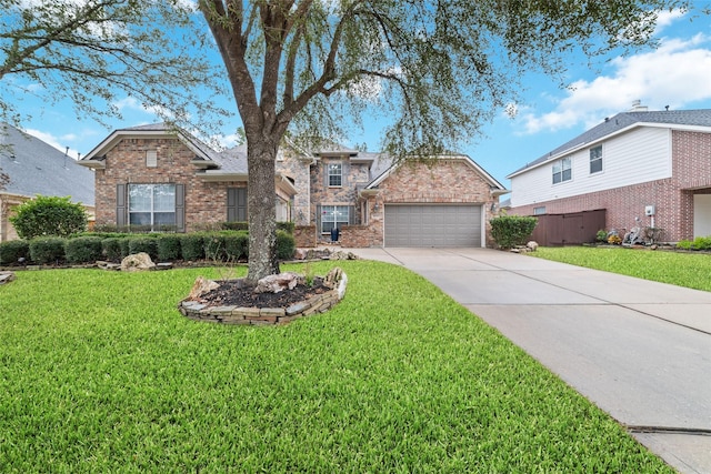 view of front facade with a front yard and a garage