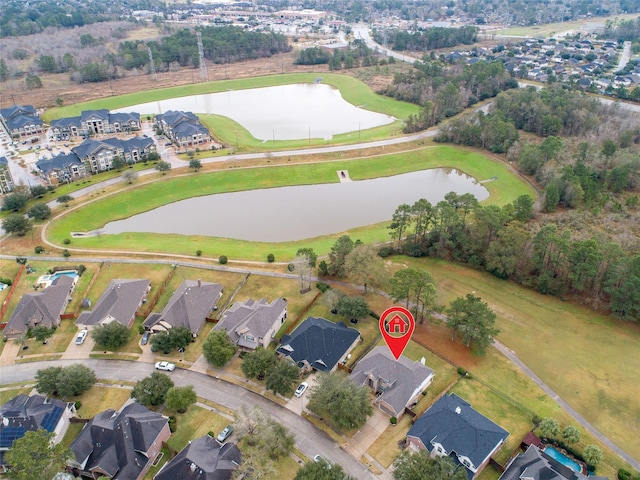 bird's eye view with a water view