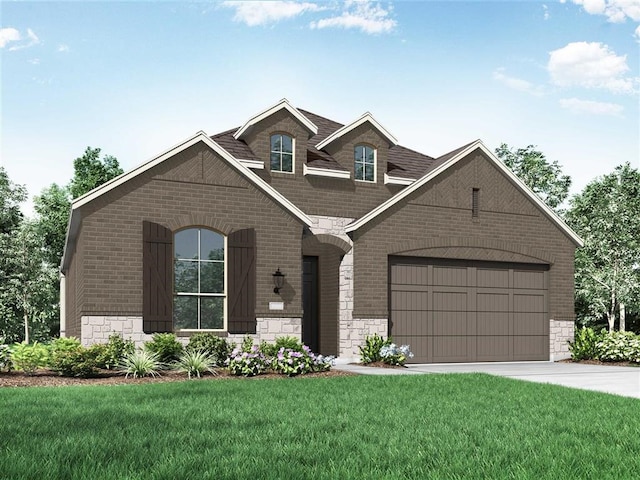 view of front of property featuring a garage and a front yard