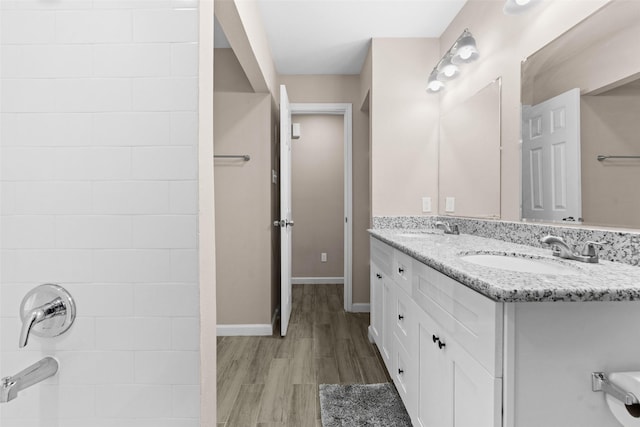 bathroom with vanity and hardwood / wood-style flooring