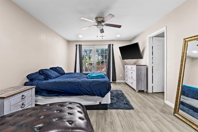 bedroom with light hardwood / wood-style flooring, french doors, and ceiling fan