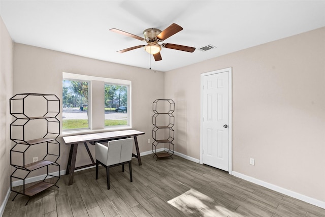 office area with ceiling fan and hardwood / wood-style floors