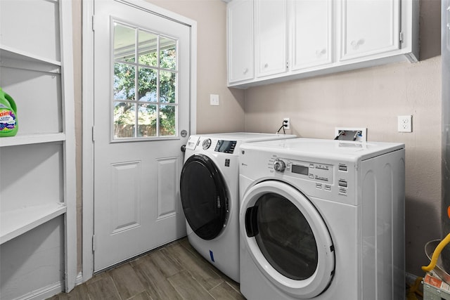 laundry room featuring cabinets and washer and dryer