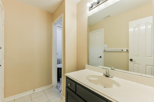 bathroom featuring tile patterned flooring and vanity