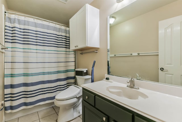 bathroom featuring toilet, vanity, and tile patterned floors