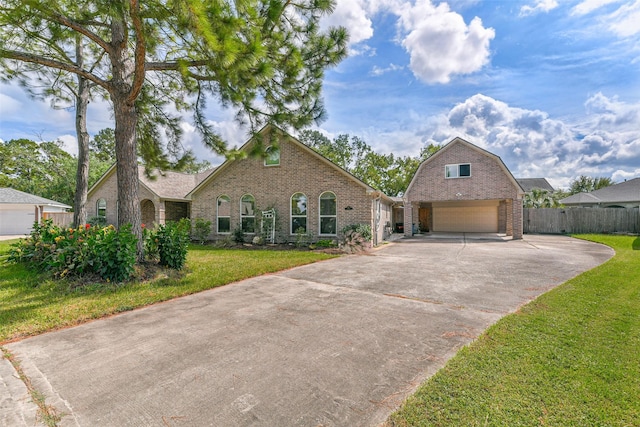 view of front facade with a front yard and a garage