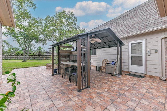 view of patio featuring an outdoor bar, a gazebo, and ceiling fan