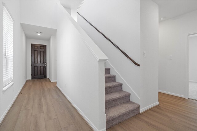 8203 Leisure Point Dr, Cypress, TX 77433 - entrance foyer with light wood-type flooring, stairway, and baseboards