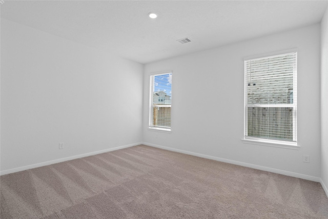 8203 Leisure Point Dr, Cypress, TX 77433 - empty room featuring light colored carpet, baseboards, and recessed lighting