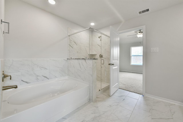 bathroom with independent shower and bath and ceiling fan