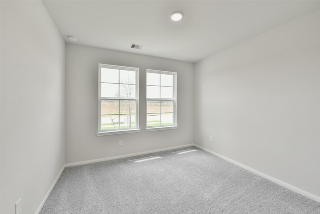 unfurnished room featuring carpet floors