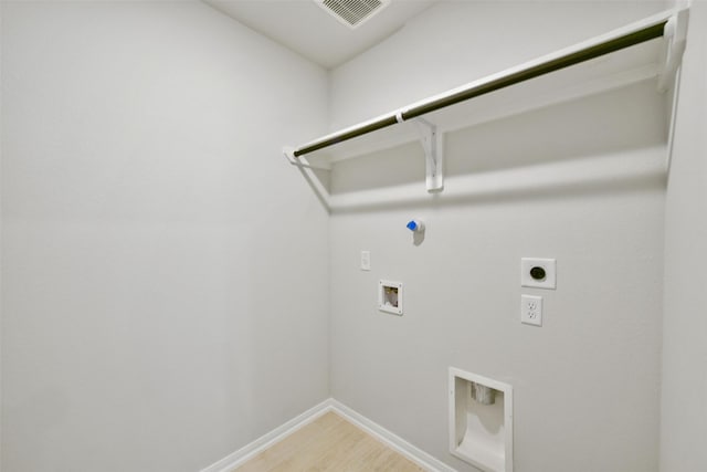 laundry area featuring hookup for a gas dryer, washer hookup, electric dryer hookup, and hardwood / wood-style floors