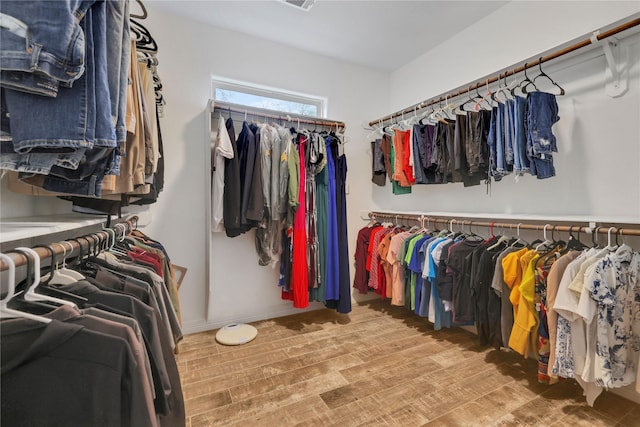 walk in closet featuring hardwood / wood-style flooring