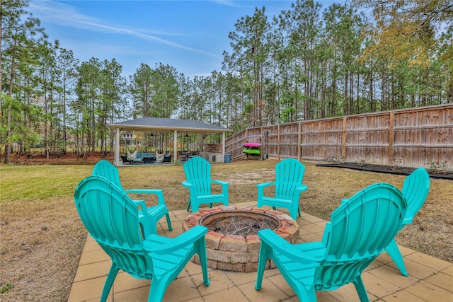 view of patio / terrace featuring a fire pit and a gazebo