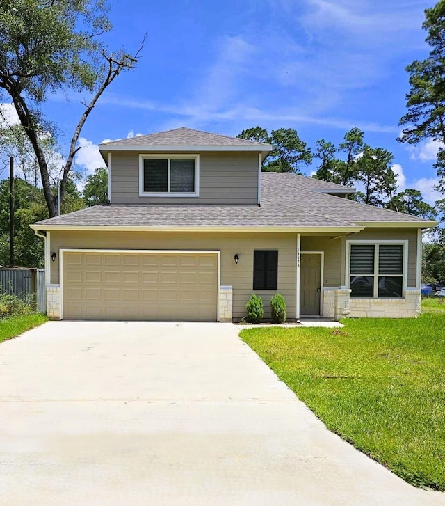 front facade with a front yard and a garage