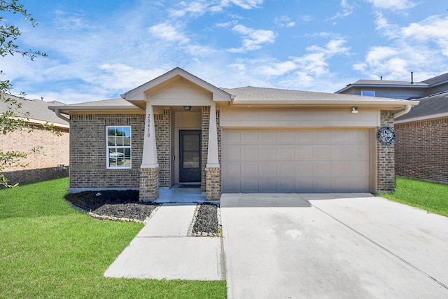 view of front of home featuring a garage and a front yard