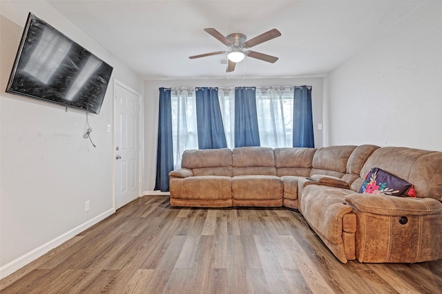 living room with ceiling fan and hardwood / wood-style floors