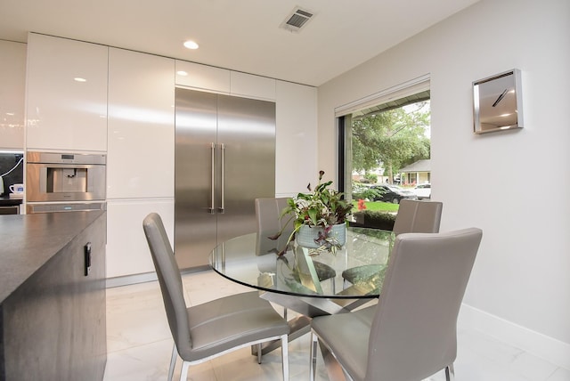 dining space with light tile patterned flooring