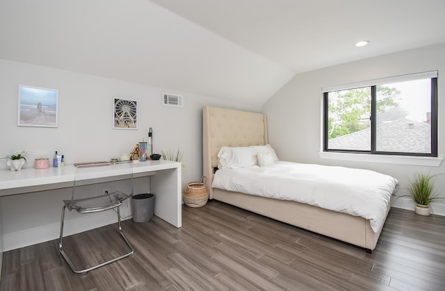 bedroom featuring vaulted ceiling and dark hardwood / wood-style floors